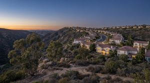 Anaheim Hills hillside homes at blue hour, editorial view for the July 2026 housing market