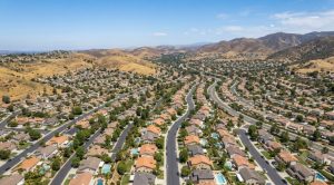 Aerial view of Yorba Linda hillside neighborhoods in clear midsummer light, July 2026 housing market update.